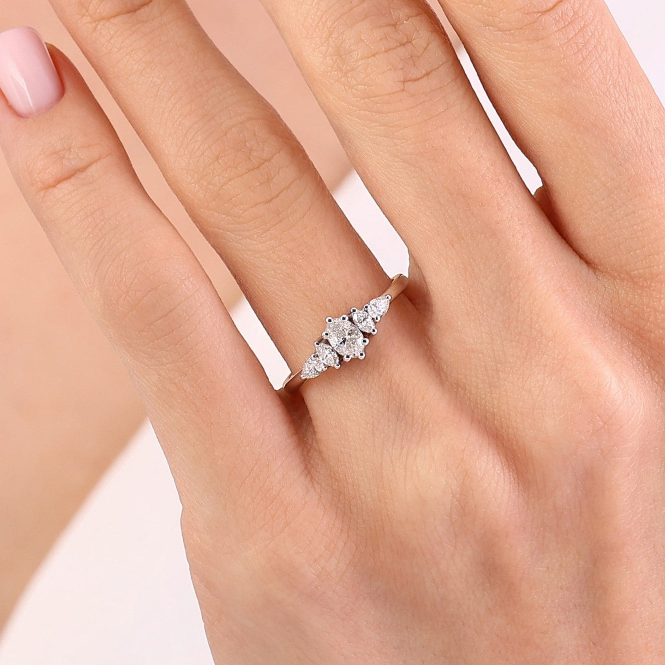 0.60 Ct. Natural Oval Diamond Ring with Marquise & Pear Side Diamonds