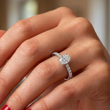 0.65 Ct. Natural Oval Diamond Solitaire Ring with Side Stones