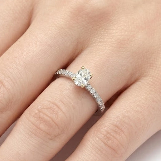0.70 Ct. Natural Oval Diamond Solitaire Ring with Side Stones
