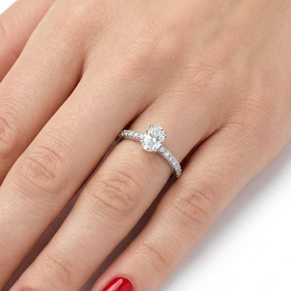 0.70 Ct. Natural Oval Diamond Solitaire Ring with Side Stones