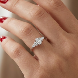 0.70 Ct. Natural Oval Diamond Ring with Marquise & Pear Side Diamonds