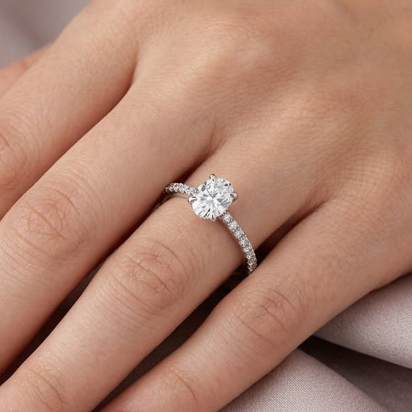 0.85 Ct. Natural Oval Diamond Solitaire Ring with Side Stones