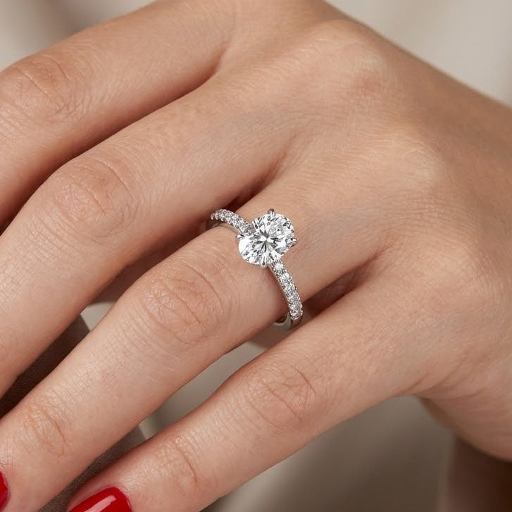 0.95 Ct. Natural Oval Diamond Solitaire Ring with Side Stones