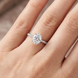 1.05 Ct. Natural Oval Diamond Side Stone Solitaire Ring